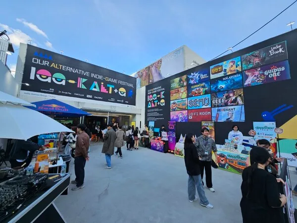Visitors exploring indie game exhibition booths at the first ALT+G festival